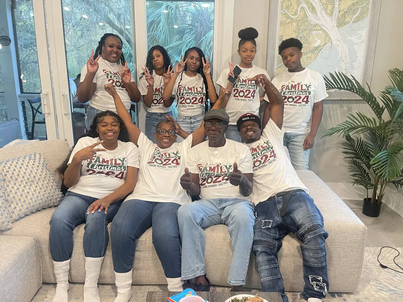 A family in matching Family Christmas 2024 shirts, made by ABAC