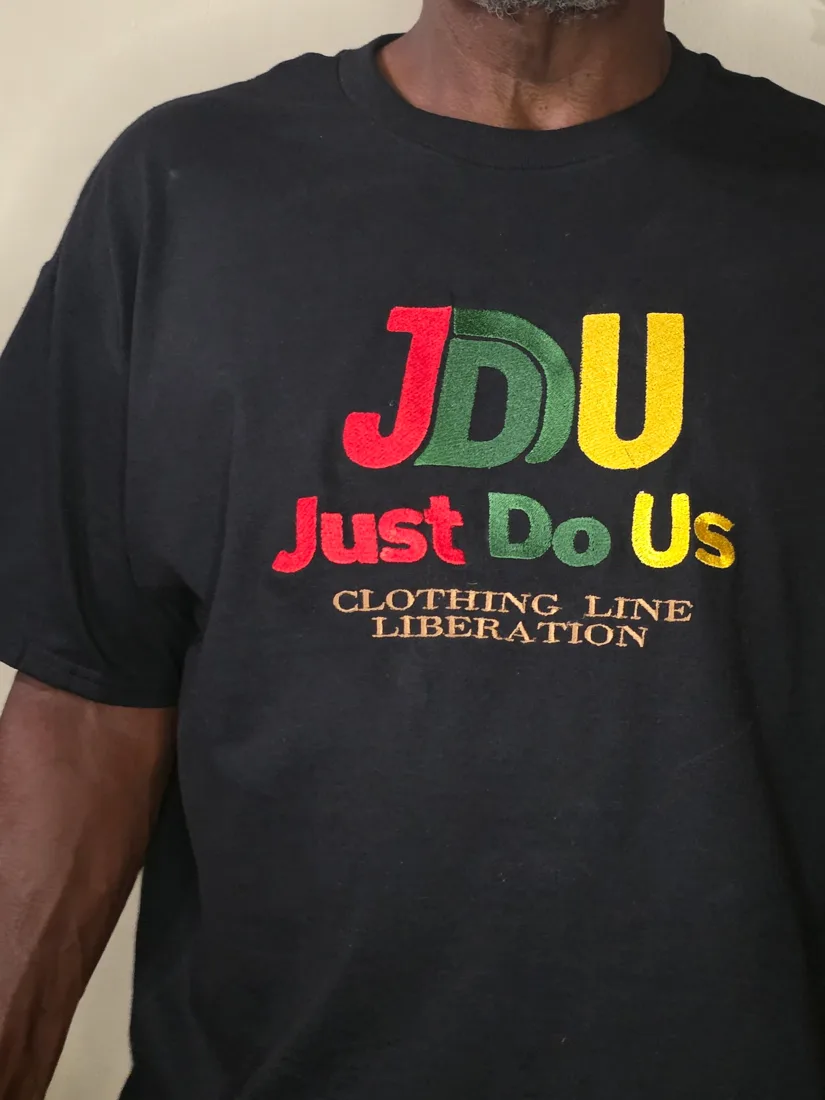 JDU Classic embroidered on a black shirt