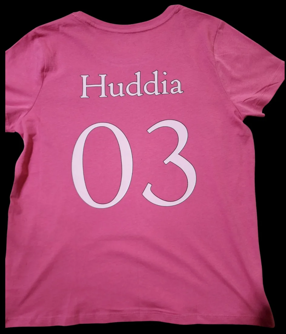 Custom name and number on the back of a pink shirt