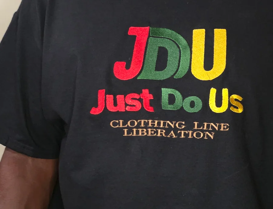 JDU Classic logo embroidered on a black t-shirt